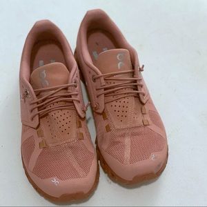 On Running shoes.  Rose size 7